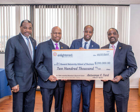 Men holding a check